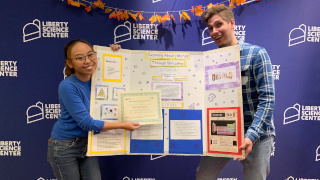 Anne Pino (left) and Andrew D’ Amato (right) smile and pose with their winning demo.