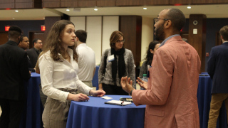 Student mentee and alumni mentor networking at the kick-off CHAMP event. 
