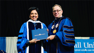 Image of former PepsiCo CEO Indra Nooyi with President Nyre