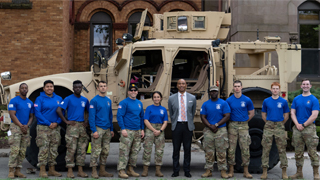 is NJ Army National Guard and Pirate Battalion posing in front of the Army M-ATV.