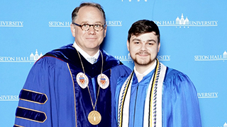 President Nyre with valedictorian Timothy Georgetti 