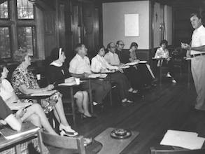 1970s. Reverend Leo Humanae conducting class for lay students and sisters. - Farley