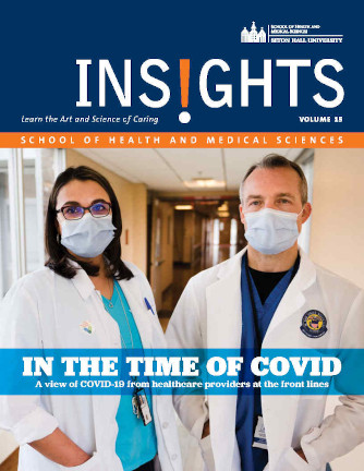 The cover of SHMS Insights Magazine showing two doctors wearing masks. 