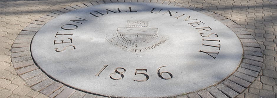 An image of the seal on the University Green. 