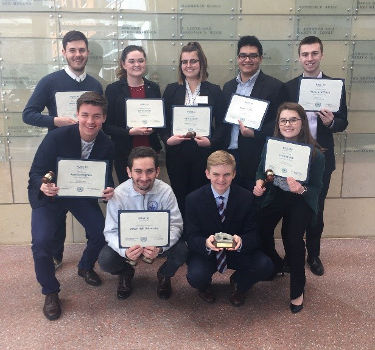 Model UN Team poses with their awards after winning 8 individual awards, 2 verbal commendations and Best Large Delegation at Penn State Model UN conference.