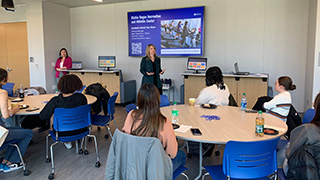 Photo of students at the “Boss Lady” event listening to Jennifer Santiago’s presentation, “Value of Diversity and Female Leadership in the Workplace.”