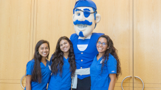 Nursing students pose with the pirate