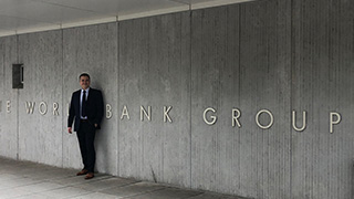Professor Giuseppe M. Fazari standing outside the World Bank Group.
