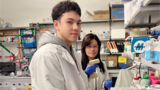 Professor Chu and James Primerano working in the lab.