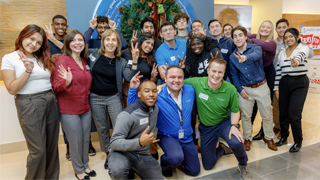 Image of students and faculty visiting Fusion Health.