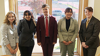 a photo of students from the Brownson Speech and Debate Team