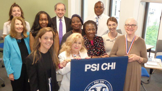 Prof. Brady-Amoon with members of Psi Chi. 