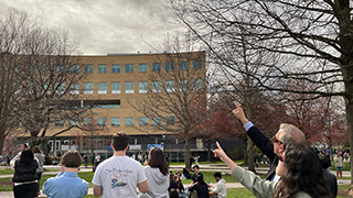 Students viewing the solar eclipse outside Jubilee Hall