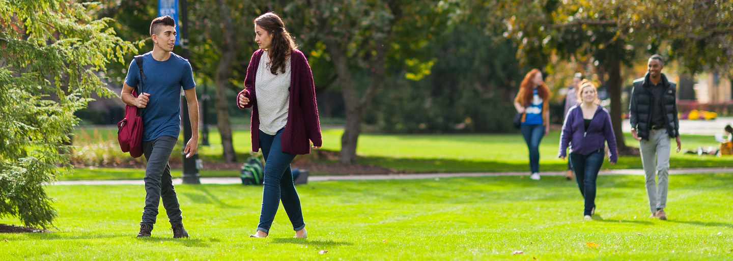 Students walking on the green